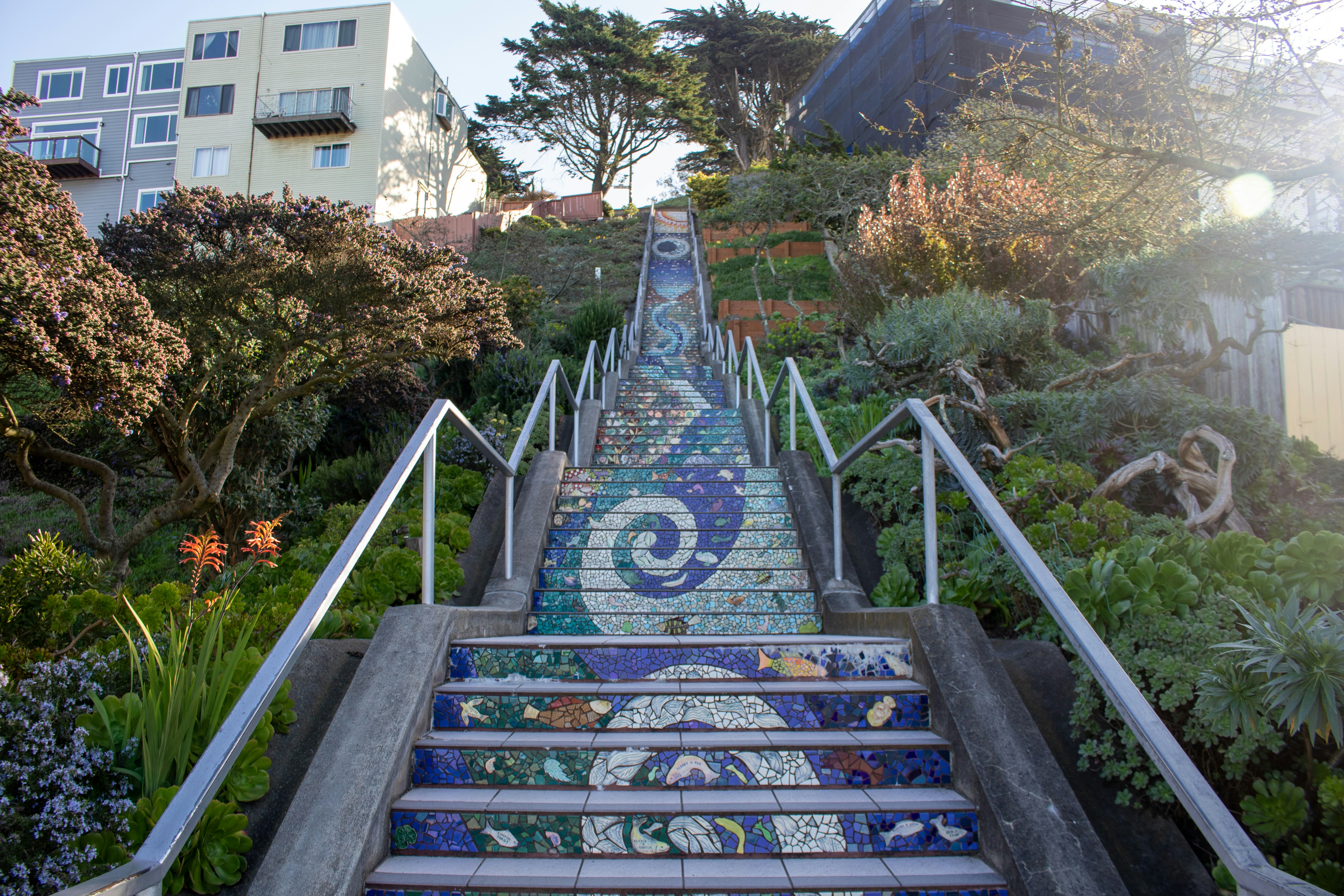 a set of stairs that have been painted with blue and white designs