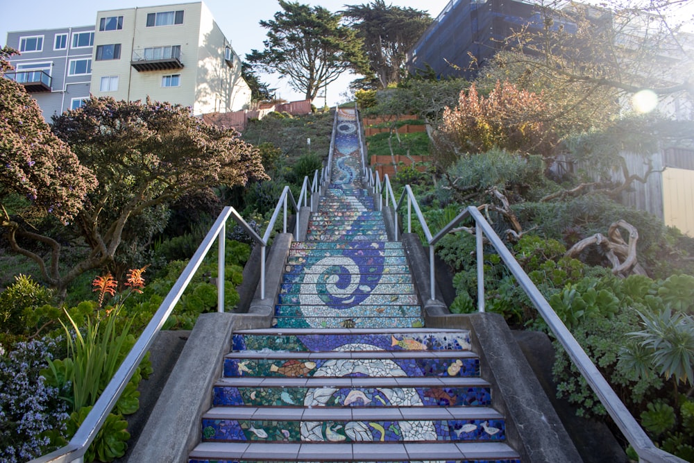 a set of stairs that have been painted with blue and white designs