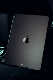 an apple ipad sitting on top of a desk