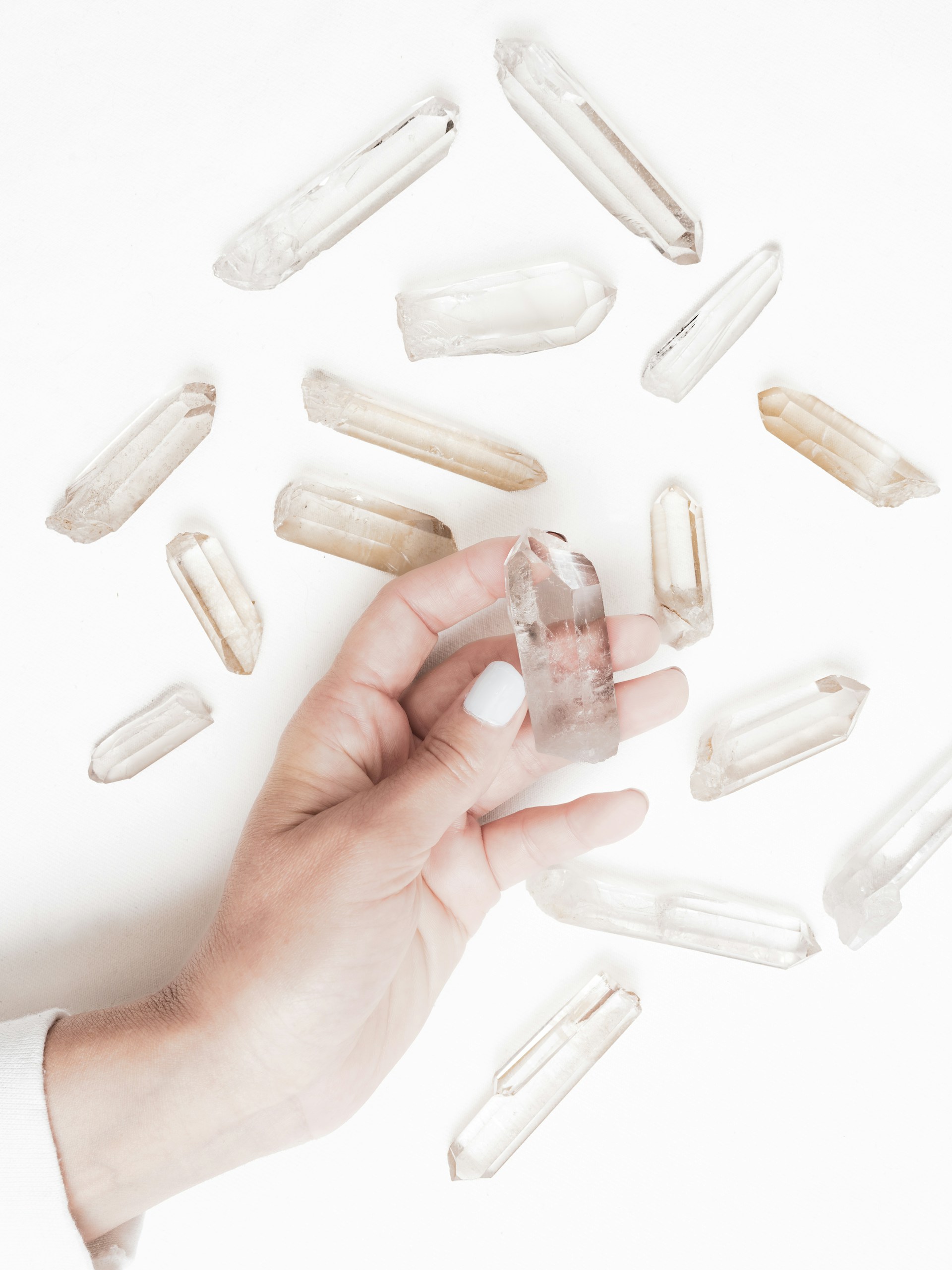 a person is holding a pill in their hand