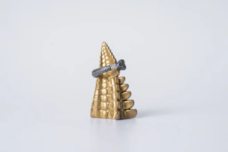 Premium abacus with golden and rose gold accents on a clean white background.