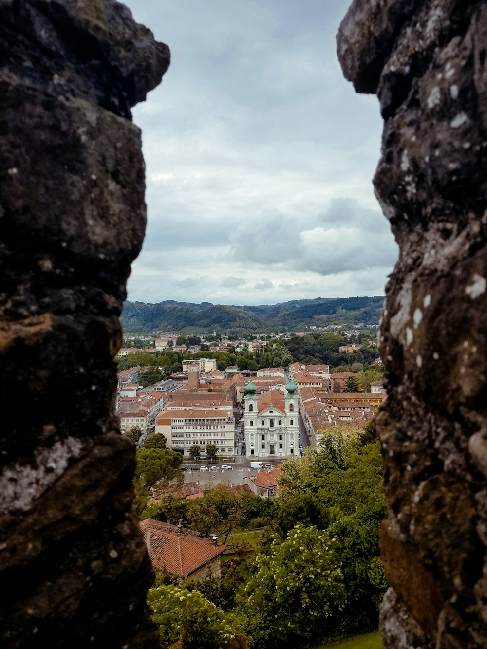 a view of a city from a window in a castle