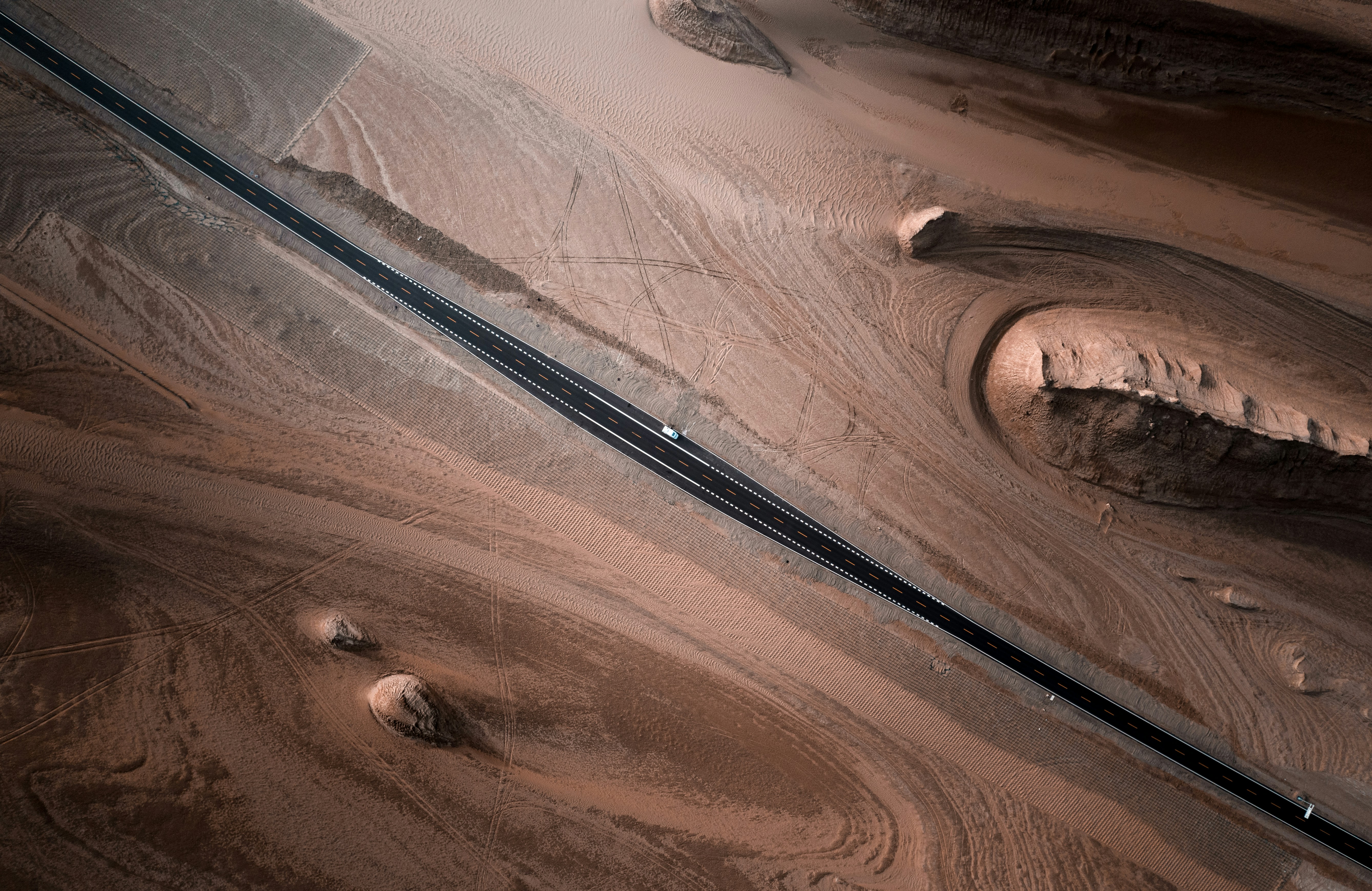 a close up of a wooden surface with a train track