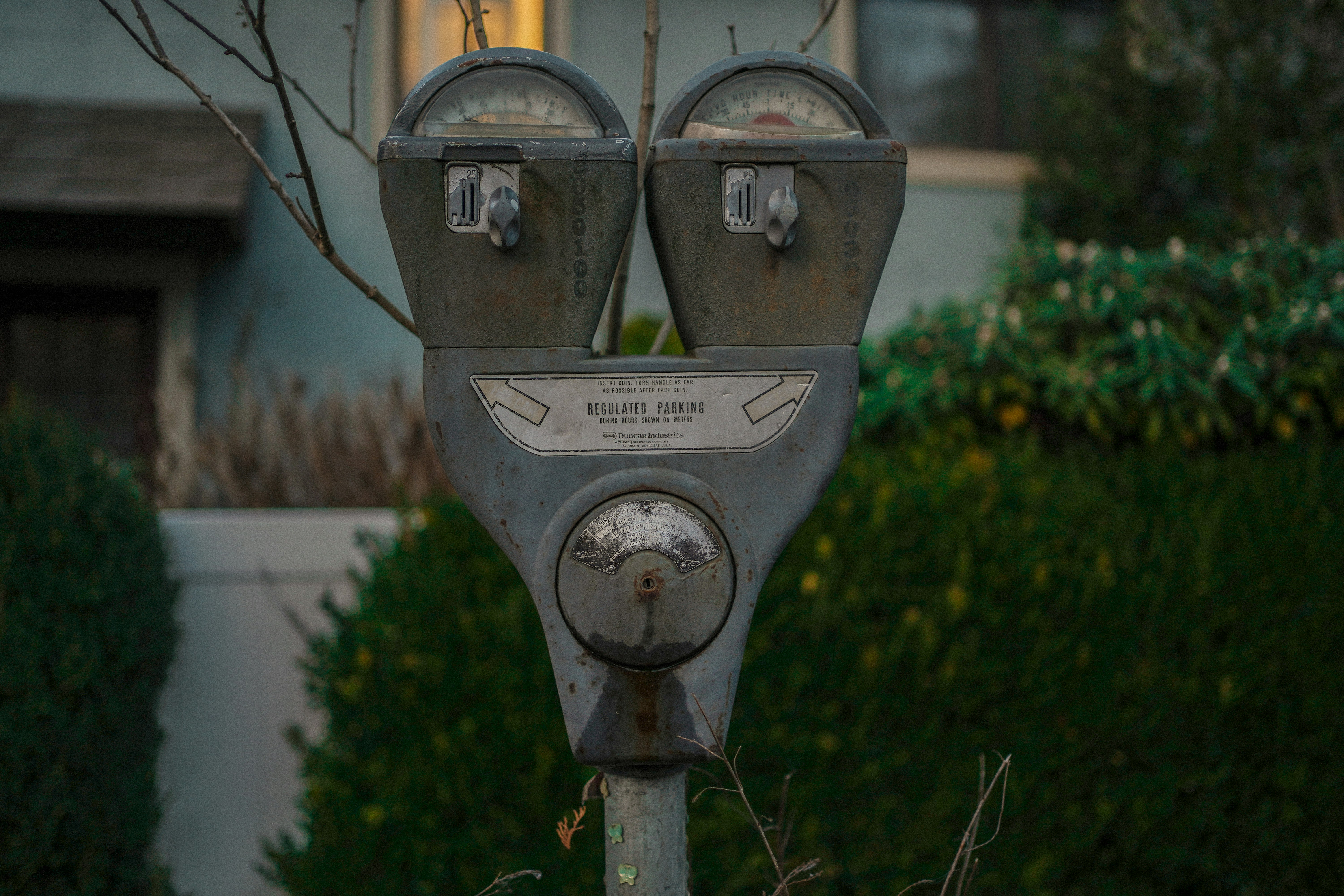 a parking meter in front of a house