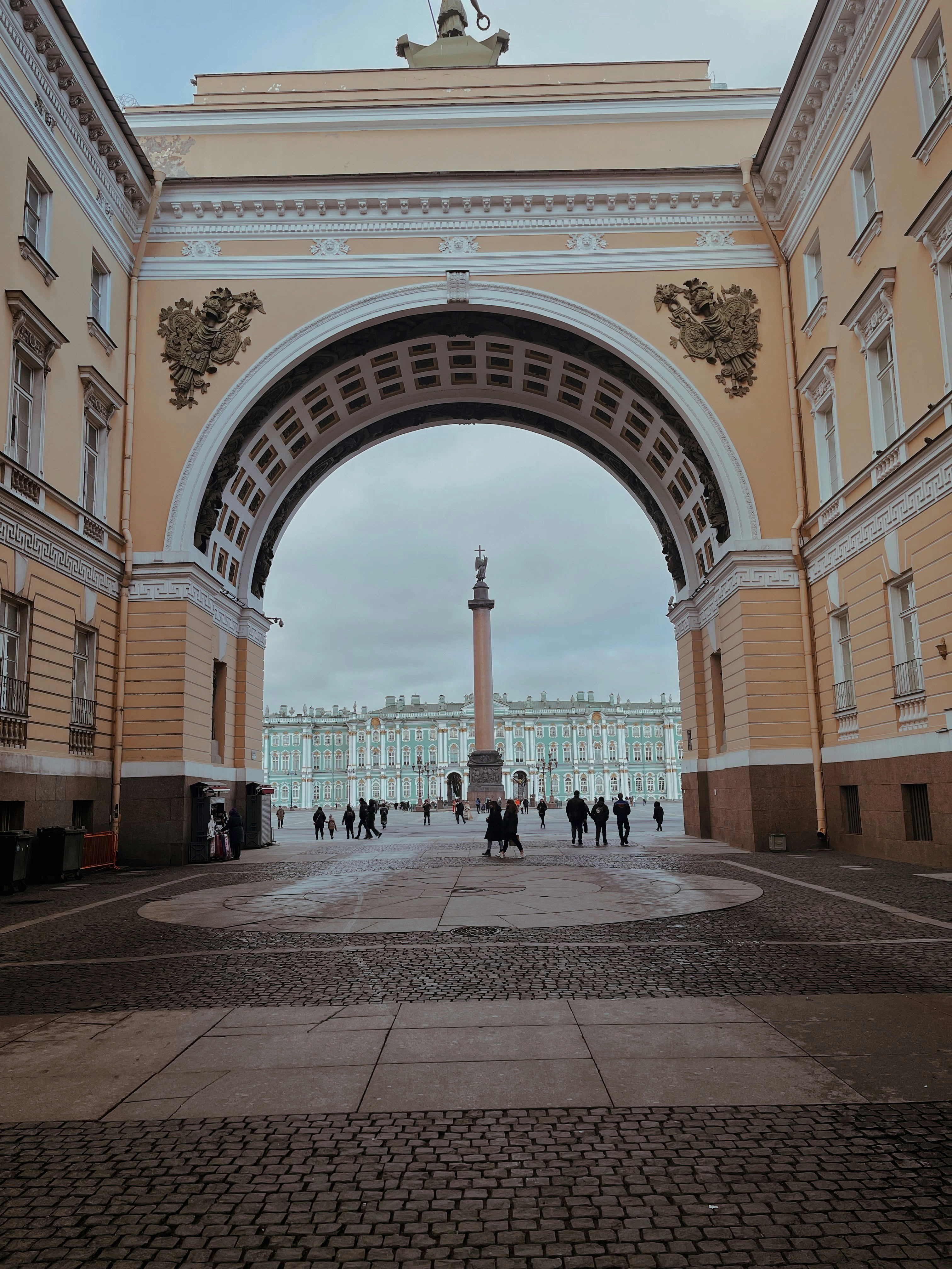 a large archway with a statue on top of it