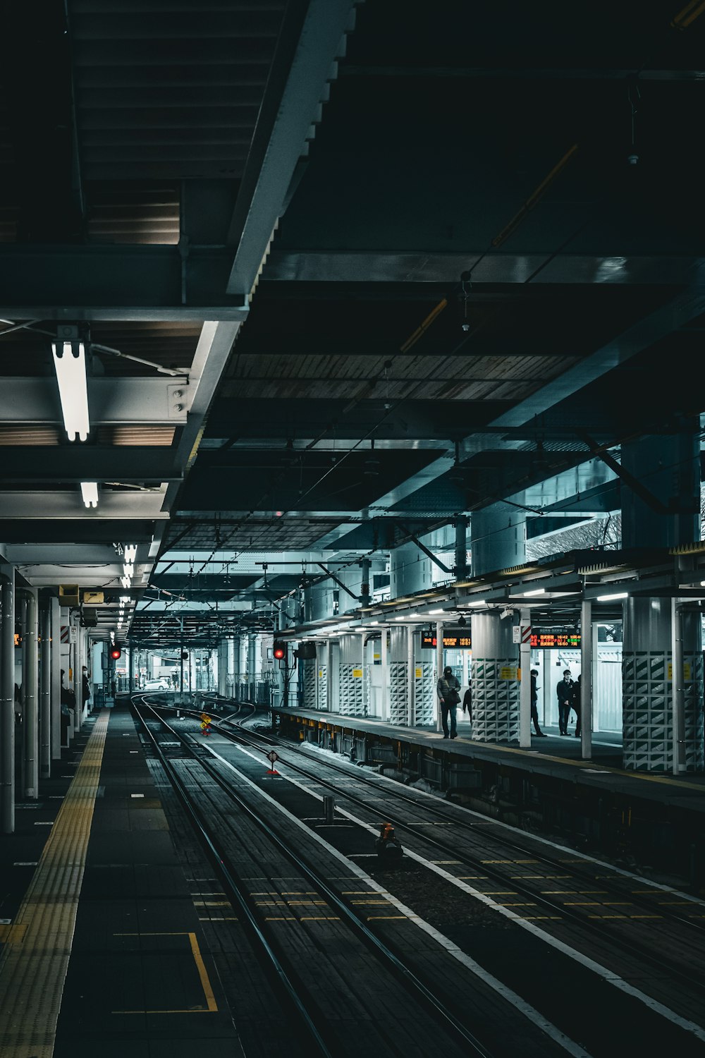 a train station with a train on the tracks