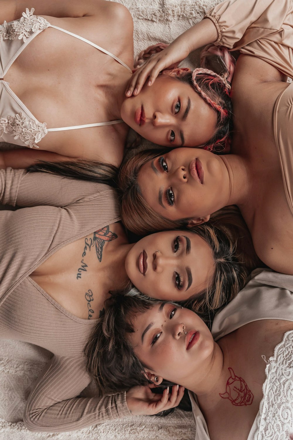 a group of women laying on top of each other