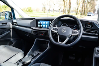 Neumorphic style UX/UI design showing four car-related icons connected by arrows representing a smooth process.