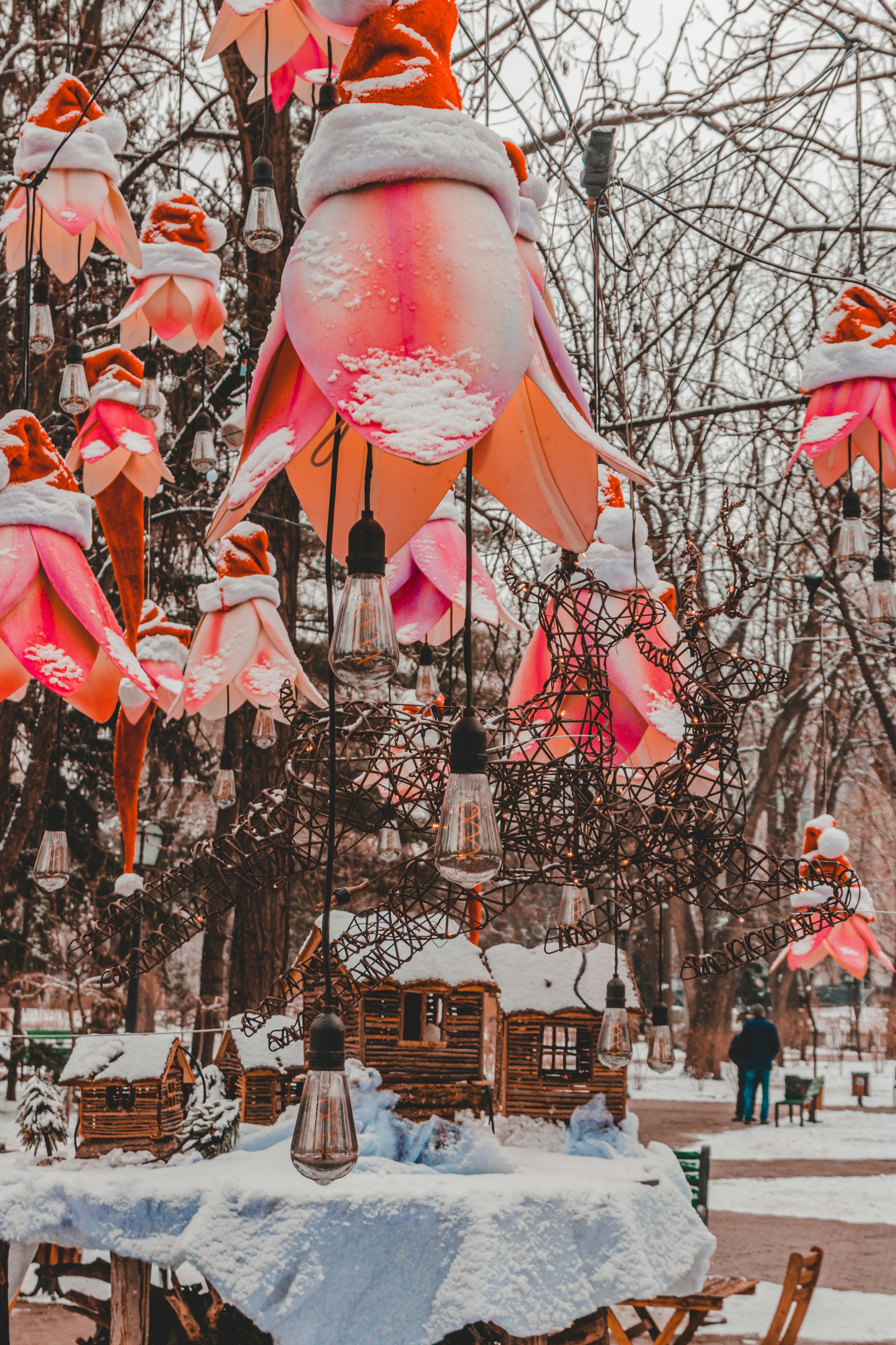 A vibrant display of winter thermals hanging in a bustling mall, bright colors contrasted against a snowy backdrop