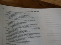 A close-up view of a page from a book showing text from Isaiah 45:18. The page is marked with the number 547 at the top left. The text includes a dialogue with questions addressing creation and references to the LORD, highlighting themes of divine craftsmanship and authority.