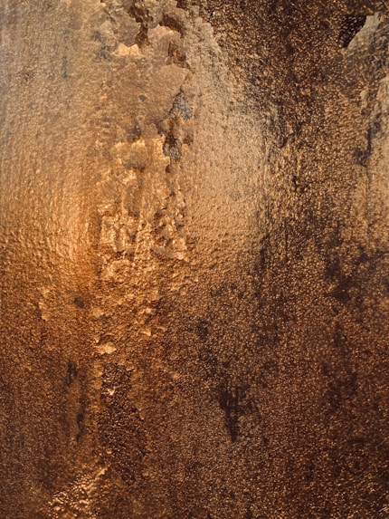 a close up of a wall with a brown substance on it