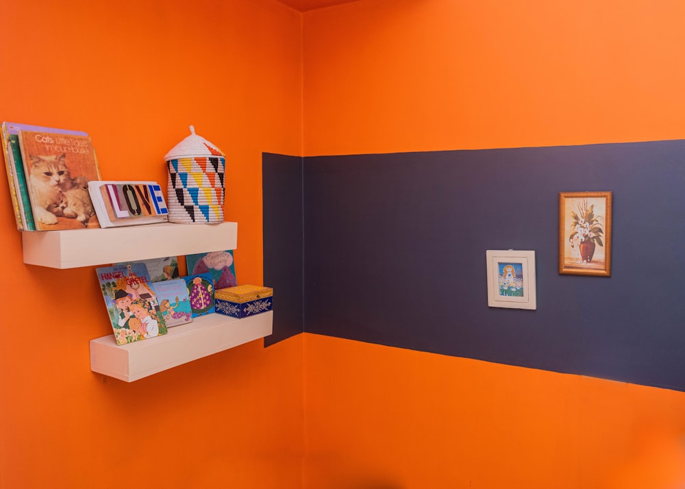 a child's room with orange walls and blue walls