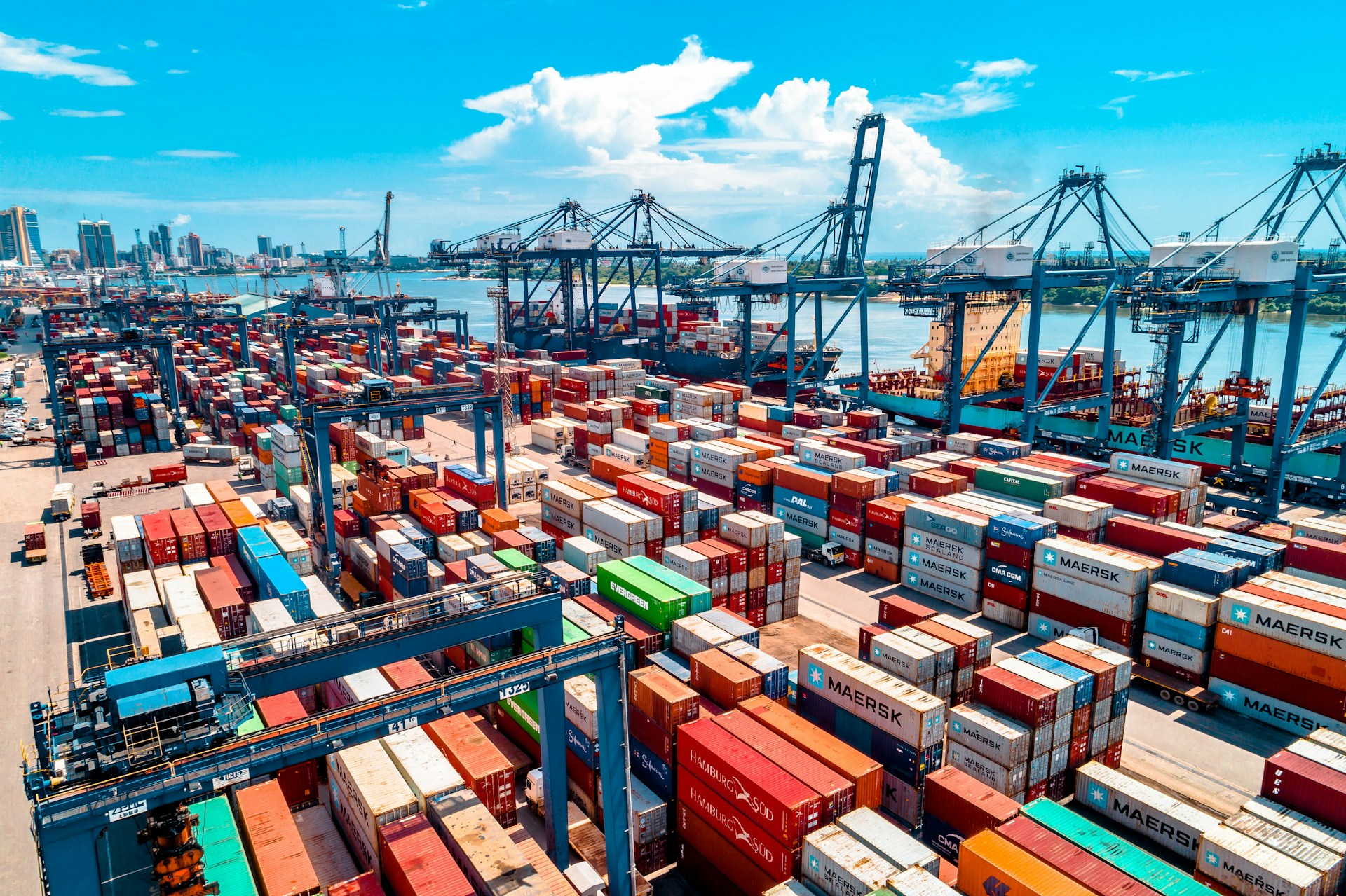 a large amount of containers are stacked on top of each other