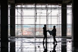 Construction workers reviewing blueprints on a building site.