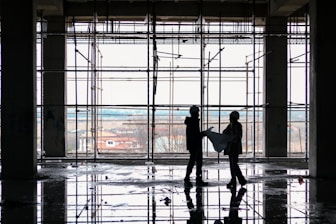 a couple of people that are standing in a building