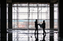 Engineers reviewing blueprints at a construction site office.