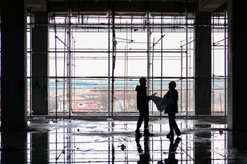 a couple of people that are standing in a building