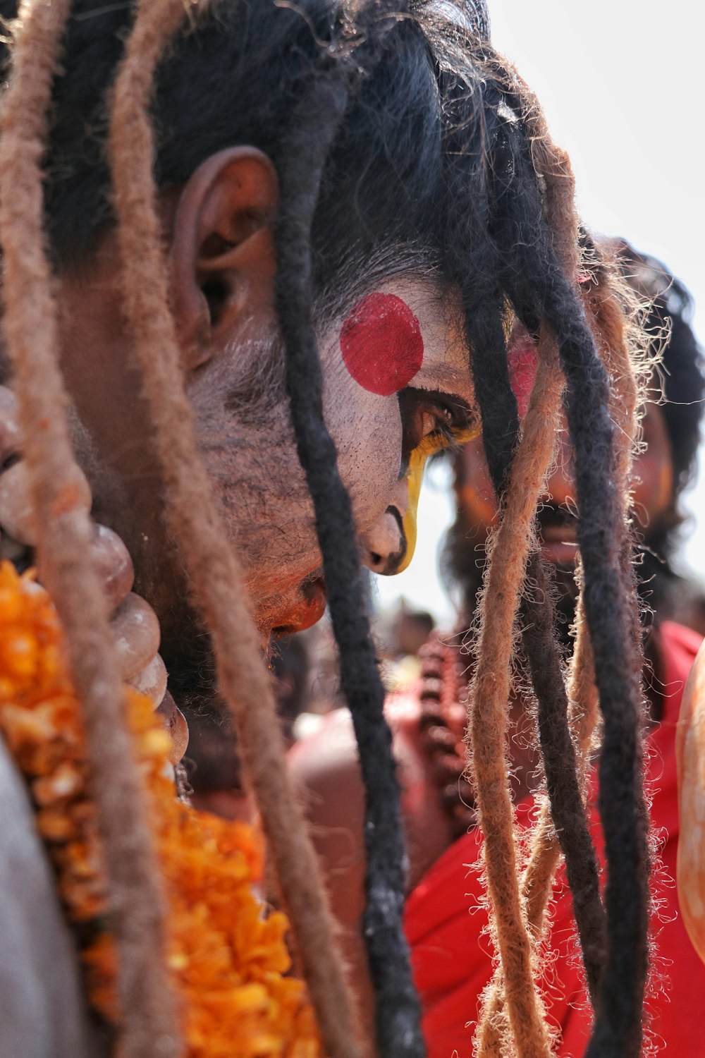 a group of people with clown makeup and dreadlocks