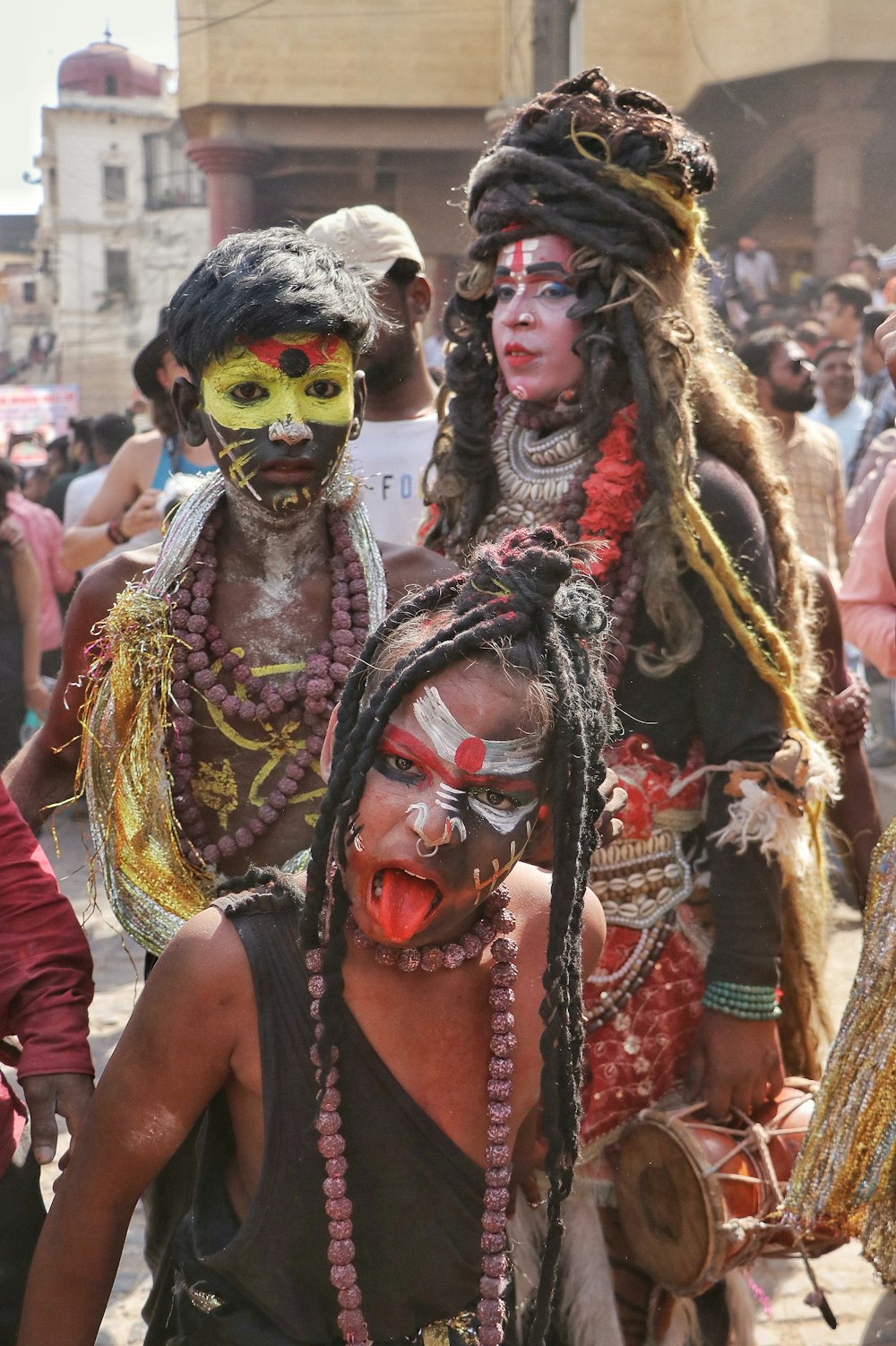 a group of people with painted faces and body paint