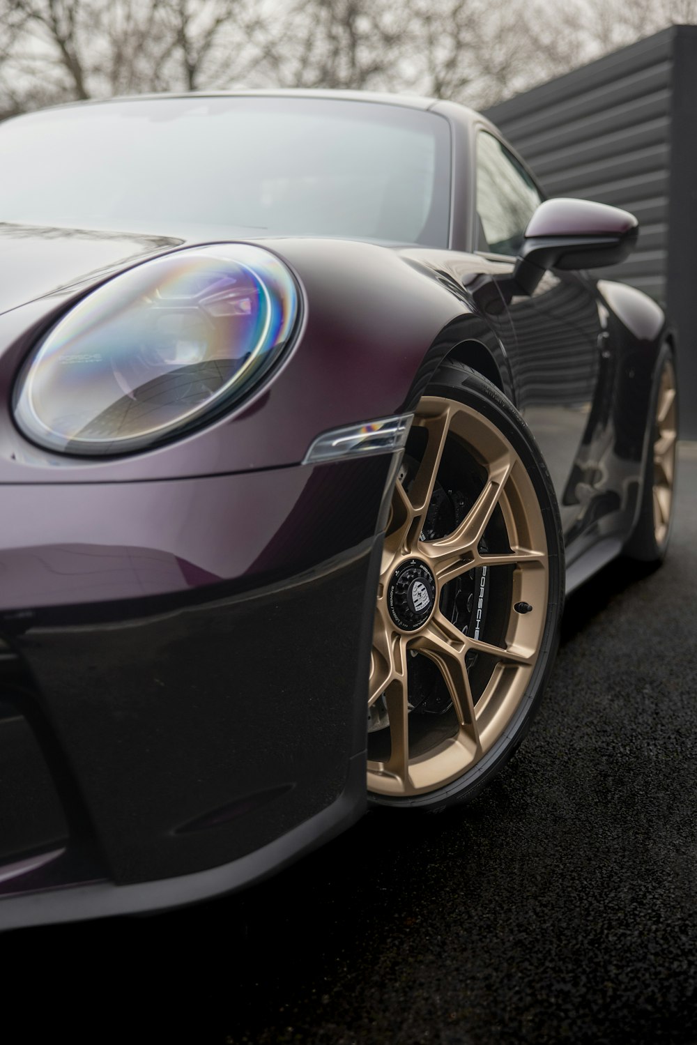 a purple sports car parked in a parking lot