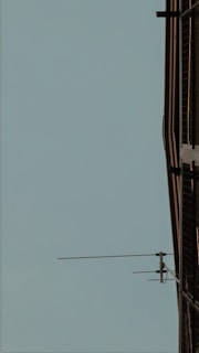 Exterior shot of a commercial building with visible technical installations on the facade.