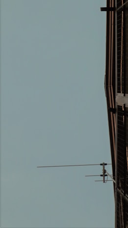 Exterior shot of a commercial building with visible technical installations on the facade.