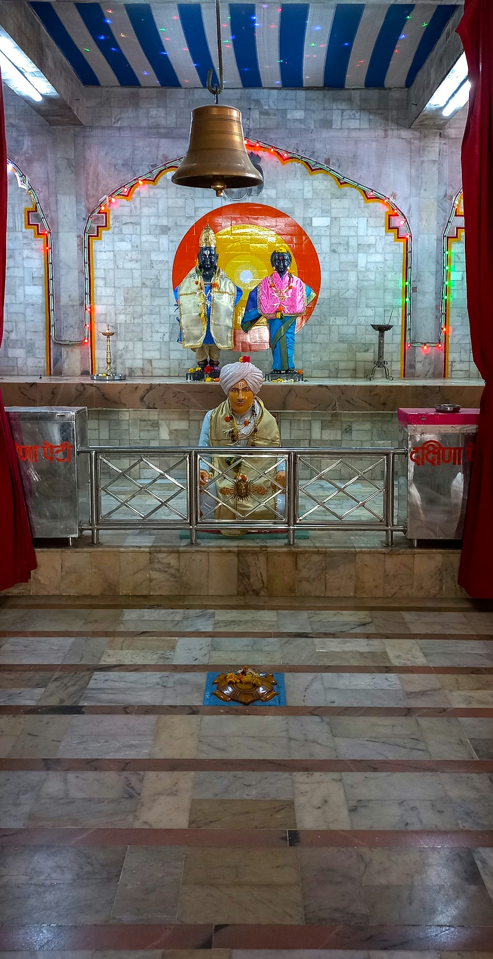 a bell hanging from the ceiling of a church