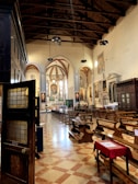 Recent image of the renovated church interior featuring modern lighting and restored woodwork.