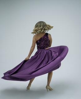 Close-up of a customer spinning with hair and dress swirling gracefully around them