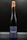 A tall, elegant wine bottle with a dark label featuring the word 'ENDER' prominently in white. The bottle is sealed with brown wax that appears to be dripped down the neck. The background is a plain, dark shade, emphasizing the bottle's sophisticated design.