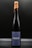 A tall, elegant wine bottle with a dark label featuring the word 'ENDER' prominently in white. The bottle is sealed with brown wax that appears to be dripped down the neck. The background is a plain, dark shade, emphasizing the bottle's sophisticated design.