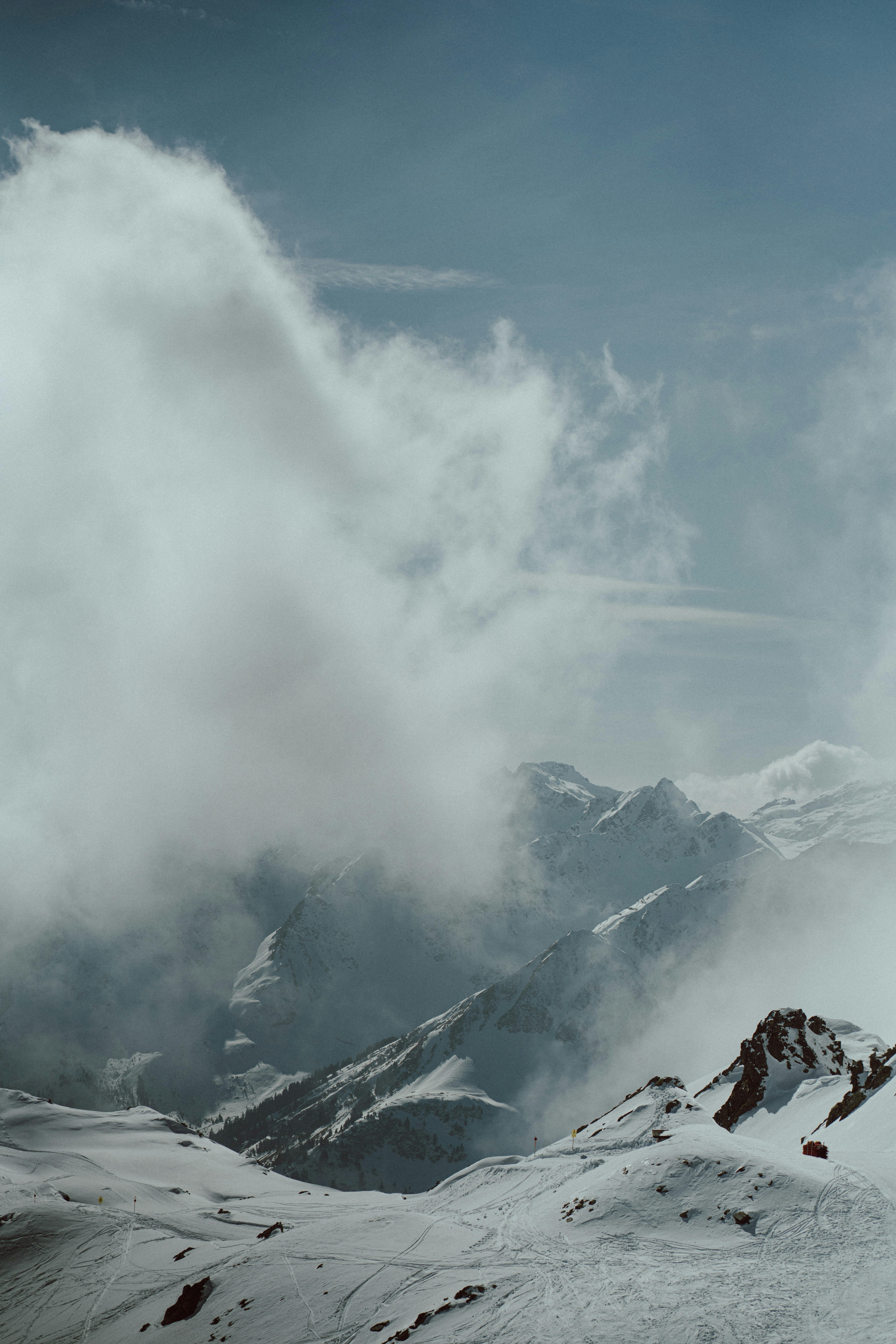 a man riding skis on top of a snow covered slope