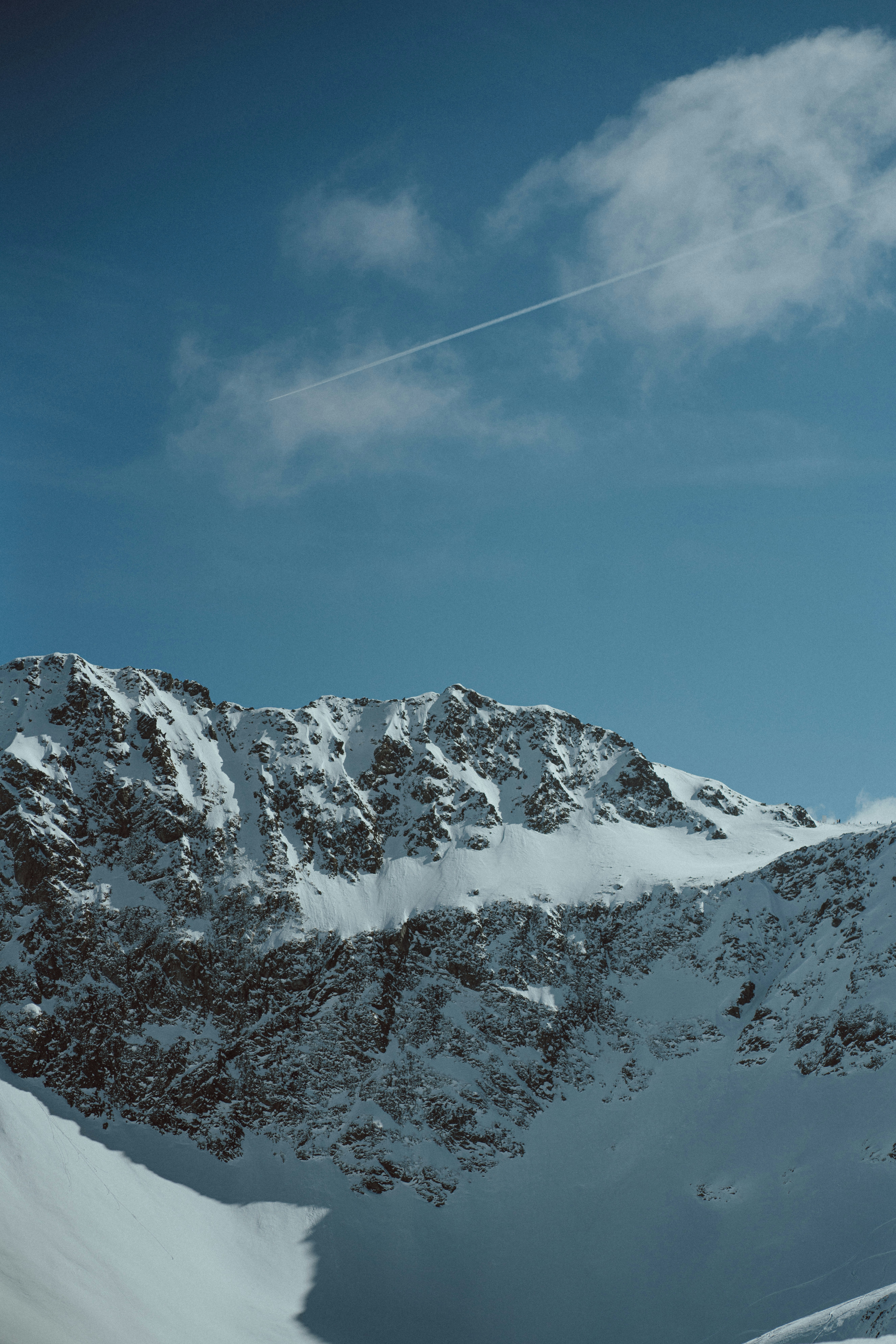 a person riding skis on a snowy surface