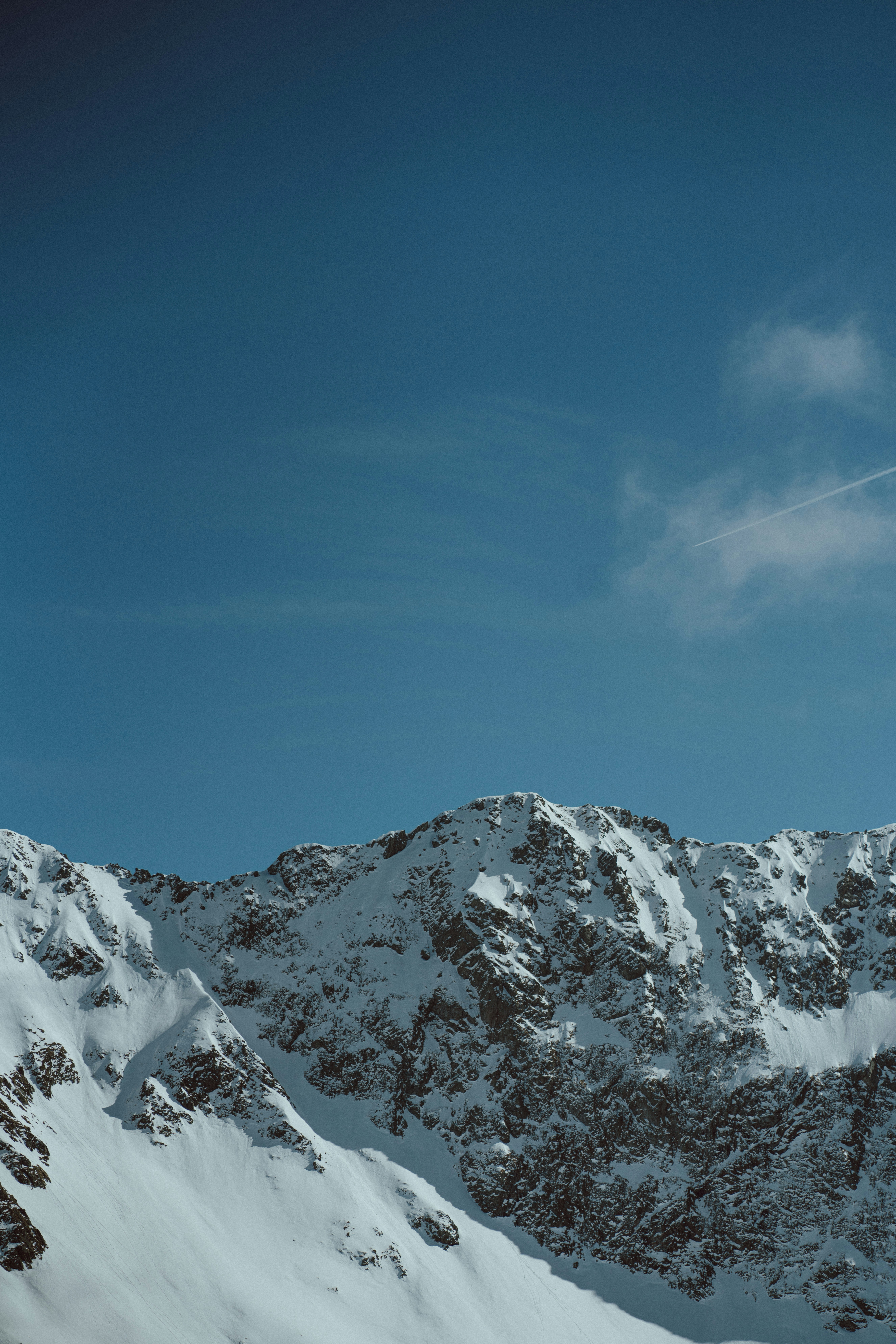 a person skiing down a snow covered mountain