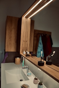 A bright bathroom with compact, stylish accessories that maximize counter space.