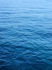 a boat floating on top of a large body of water