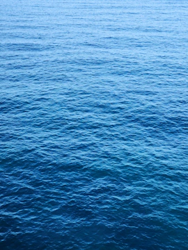 a boat floating on top of a large body of water