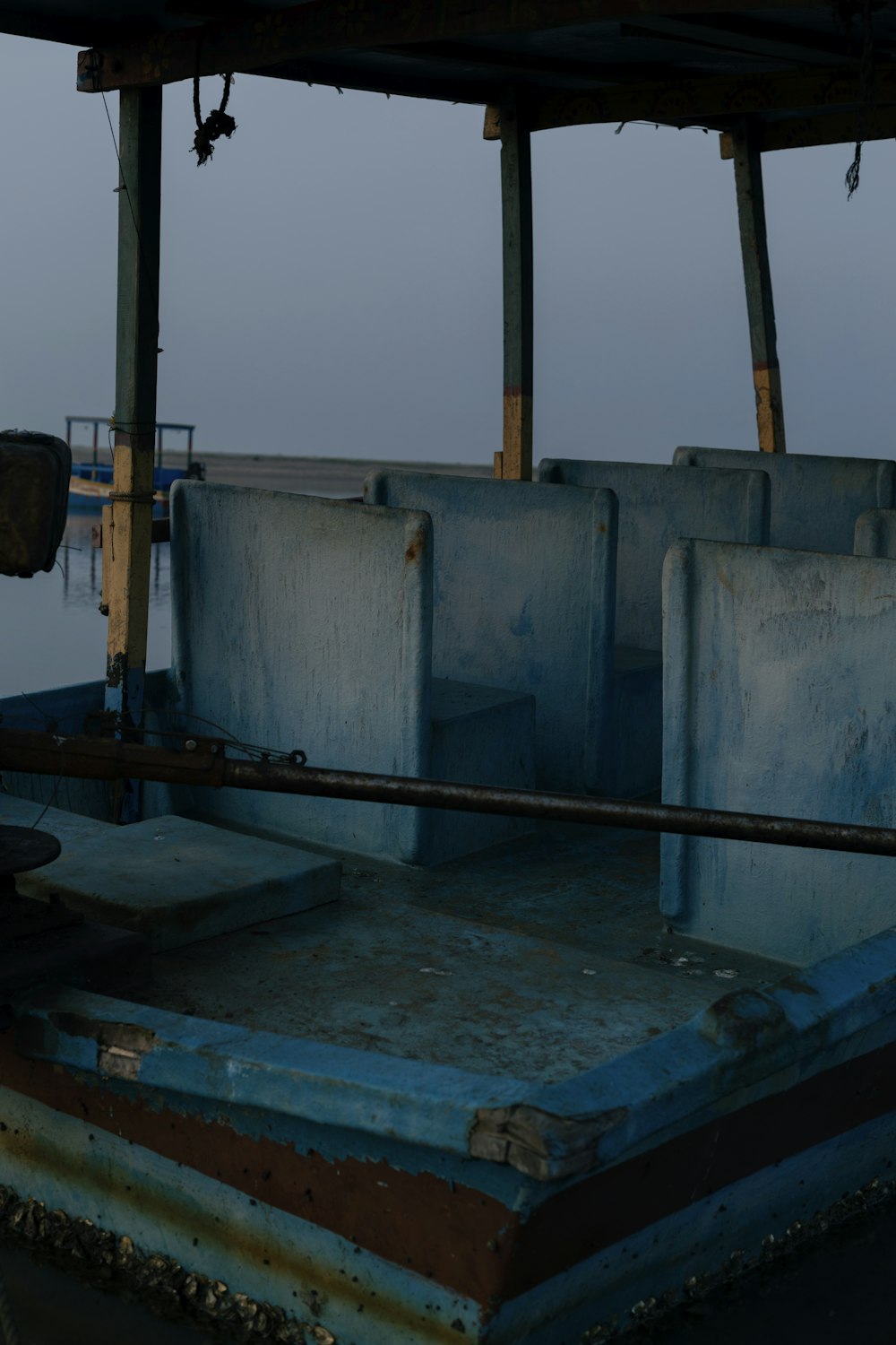 the back of a boat that is sitting in the water