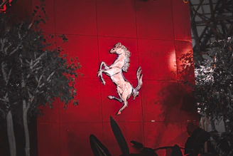 Elegant logo design for an Arabian horse stable with gold accents on dark background