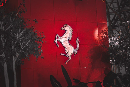 Elegant logo design for an Arabian horse stable with gold accents on dark background