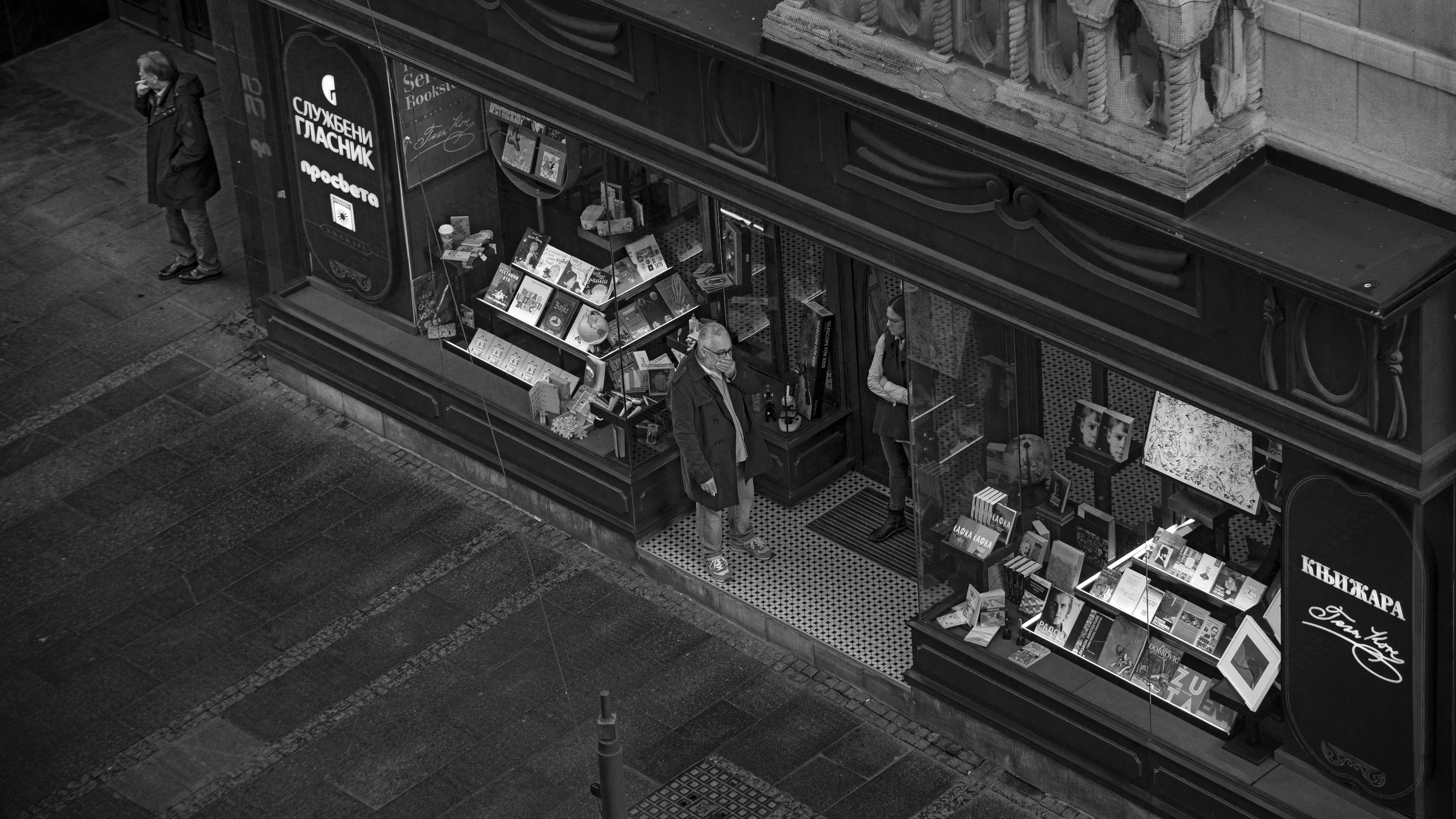 a black and white photo of a store front