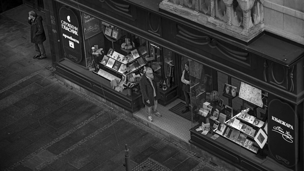 a black and white photo of a store front