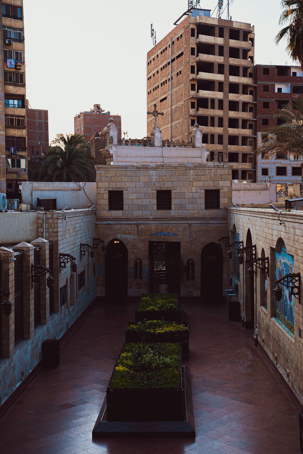 a courtyard in a city with a lot of tall buildings