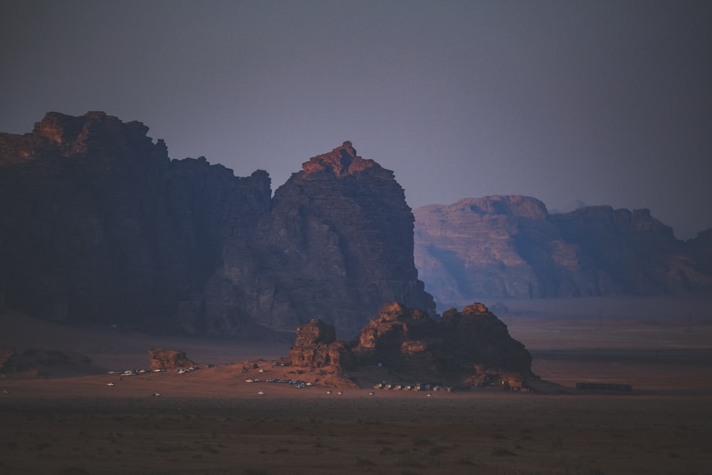 a desert landscape with mountains in the background