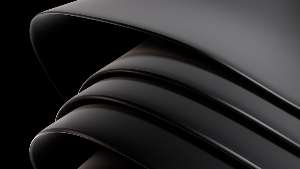 a close up of a black background with curves