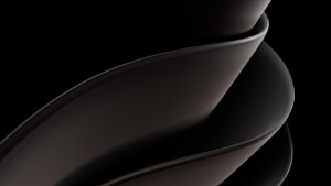 A sleek, smooth, and abstract form consisting of overlapping curved surfaces, primarily in dark tones and gradients. The design is fluid and modern, suggesting movement and elegance.