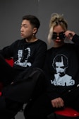 a man and a woman sitting next to each other