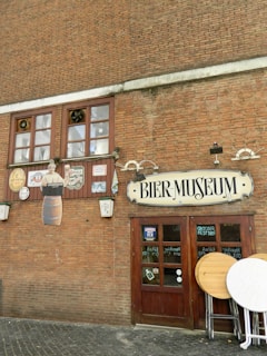 a brick building with a sign that says beer museum