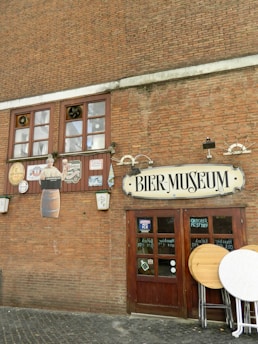 a brick building with a sign that says beer museum