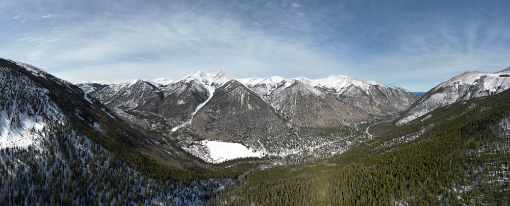 a view of a mountain range with snow on the mountains